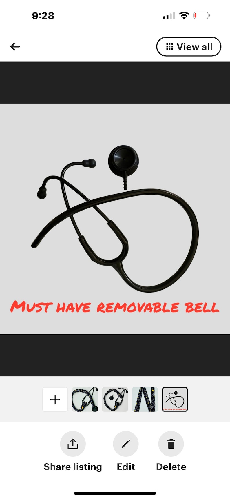 May include: Black stethoscope with a removable bell. The stethoscope is lying on a white background. The text "MUST HAVE REMOVABLE BELL" is visible below the stethoscope.