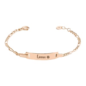 Rose gold baby ID bracelet personalized with the name 'Liana' and a flower symbol, with a clasp detail.