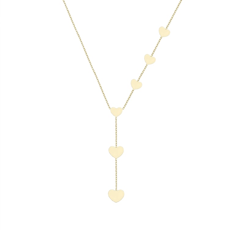 Gold heart Y necklace with descending heart pendants on a plain background.