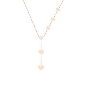 Rose Gold heart Y necklace with descending heart pendants on a plain background.