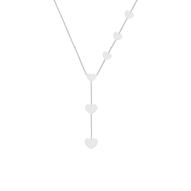 White Gold heart Y necklace with descending heart pendants on a plain background.