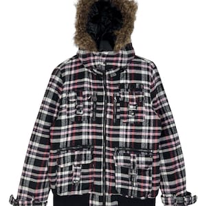 May include: Black, pink, and white plaid jacket with a faux fur lined hood. The jacket has multiple pockets and a zipper closure.
