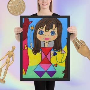 May include: A framed, colorful artwork featuring a cartoon-style figure with large blue eyes and brown hair. The figure wears a geometric dress with red, pink, and purple shapes. The background includes trees and a blue sky. The artwork is signed "Marie Simone 2019".
