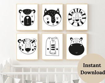May include: Six framed art prints featuring black and white illustrations of animal faces: a bear, squirrel, lion, tiger, crocodile, and hippo. The prints are displayed on a white wall, with a crib and decorative banner in the foreground.