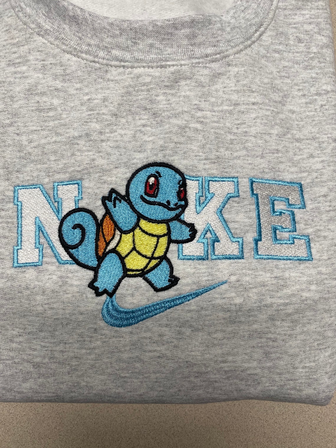 squirtle nike shirt