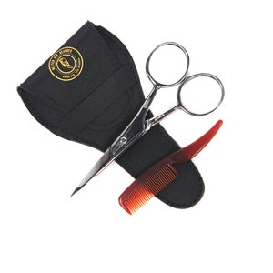 May include: A black leather case with a gold logo that says "Better Get Beards" holds a pair of silver scissors and a red comb.