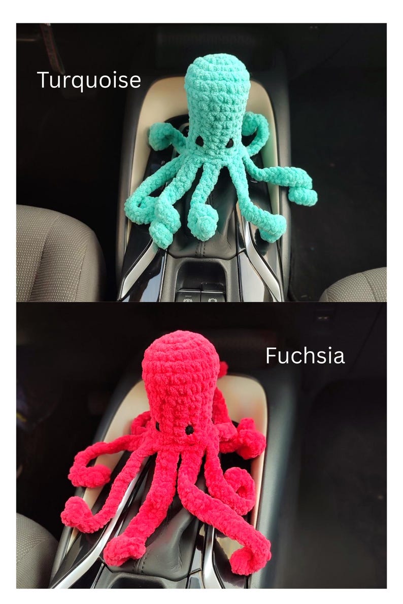 May include: Two crocheted octopus toys, one turquoise and one fuchsia, are displayed. The turquoise octopus is positioned above the fuchsia one. The text "Turquoise" and "Fuchsia" are above each octopus. The toys are placed in a car's console.