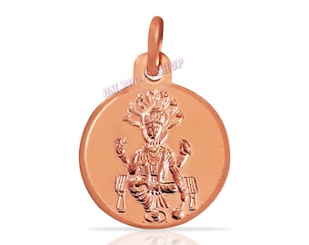 May include: A copper pendant depicting a Hindu deity, possibly Vishnu, seated on a throne with a multi-headed serpent hood above. The pendant is round and has a smooth, polished finish.