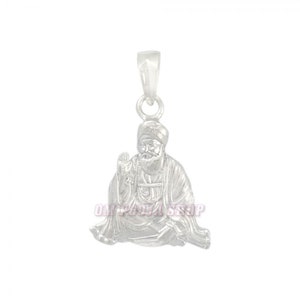 May include: Silver pendant featuring a detailed depiction of a seated figure with a beard and turban. The pendant has a loop at the top for attaching to a chain.