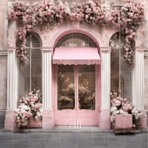May include: A pink storefront with a pink awning and double doors. The storefront is decorated with pink flowers and greenery. The text "alf studio." is visible below the doors.