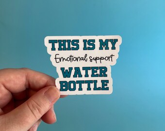 Peut inclure: Autocollant blanc avec du texte bleu qui dit "Ceci est ma bouteille d'eau de soutien émotionnel."