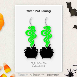 May include: A digital cut file for witch pot earrings. The earrings feature a black cauldron with green smoke rising from the top. The file is available in SVG, PNG, DXF, and PDF formats. Cricut, Silhouette, and Glowforge are mentioned.