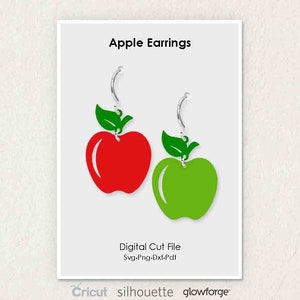May include: A pair of apple-shaped earrings, one red and one green, with silver earring hooks. The earrings are labeled "Apple Earrings" and "Digital Cut File Svg-Png-Dxf-Pdf".