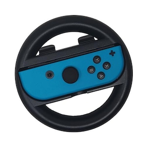 May include: A black steering wheel with a blue and black Nintendo Switch Joy-Con controller attached. The controller has buttons labeled A, B, X, Y, and a plus sign.