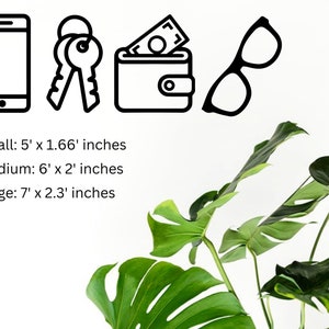 May include: Black and white line art icons of a smartphone, keys, a wallet with money inside, and eyeglasses. The icons are arranged in a row from left to right. Below the icons is text that reads "Small: 5' x 1.66' inches, Medium: 6' x 2' inches, Large: 7' x 2.3' inches".