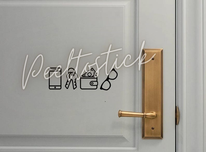 May include: A white door with a gold door handle and a black and white sticker with icons of a phone, keys, wallet, and glasses. The sticker says "Dealtostick".