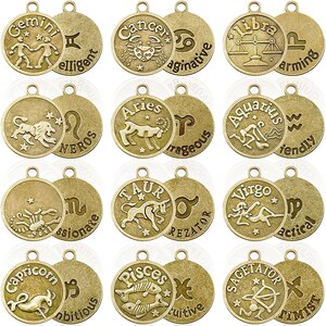 May include: Twelve gold-toned metal charms, each featuring a different zodiac sign and a descriptive word. The charms are round and have a loop at the top for hanging.