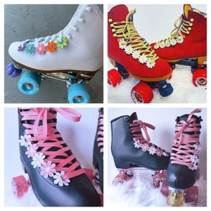 May include: Four pairs of roller skates in a collage. White, red, and black skates are decorated with daisy accents and colorful laces. The wheels are blue, red, and pink.