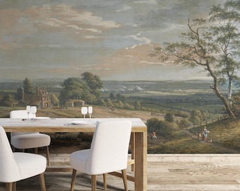 Puede incluir: Un comedor con una mesa de madera y sillas blancas, frente a un mural paisajístico. El mural representa una escena rural con colinas, árboles y un cielo nublado. La habitación tiene un suelo de madera.