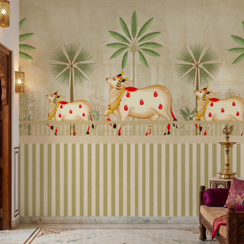 May include: A decorative wall mural featuring three cream-colored cows with red handprints, gold accents, and red and gold headwear. The cows are depicted in front of a backdrop of palm trees and a white and green striped pattern.
