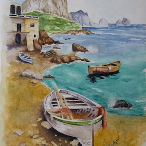 May include: Watercolour painting of a seascape with a small building on the shore, a rocky cliff in the background, and three boats in the water. The boats are white, brown, and yellow. The water is a light blue colour and the sky is a light grey colour. The painting is signed "P. Brunetti 2017".