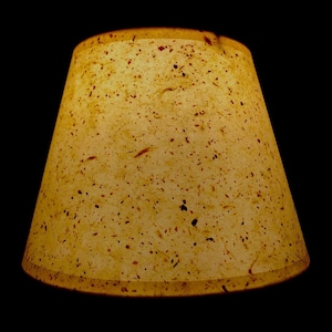 Amber flex paper parchment  hardback lamp shades in various sizes including chandelier candle clip or regular bulb clip on sizes.