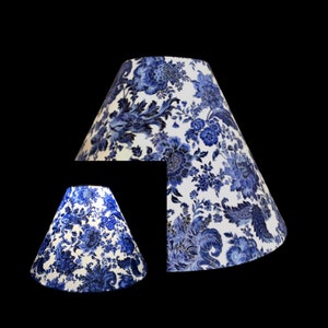 Blue porcelain floral fabric hardback lamp shades in various shapes & sizes Available w/ spider tops or bulb clip on tops.