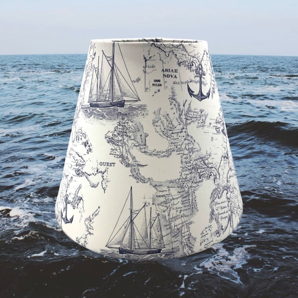 White background with navy nautical ship world map anchor lampshades. Available in various sizes and fitters.