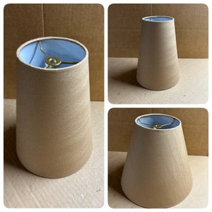 Kraft paper hardback lamp shades in various sizes. Available with spider tops, regular bulb clip, and candle clip.
