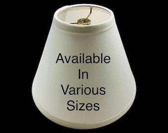 Off White linen fabric lamp shades in various custom sizes. Available with spider tops, regular bulb clip, and candle clip.