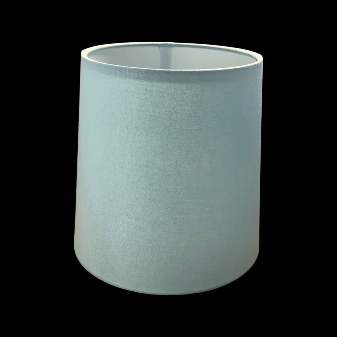 Baby blue cotton fabric hardback lamp shades in various sizes including chandelier candle clip or regular bulb clip on sizes.