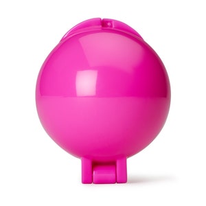 May include: A bright pink plastic egg-shaped mold with a hinged lid. The mold is designed for making round-shaped treats.