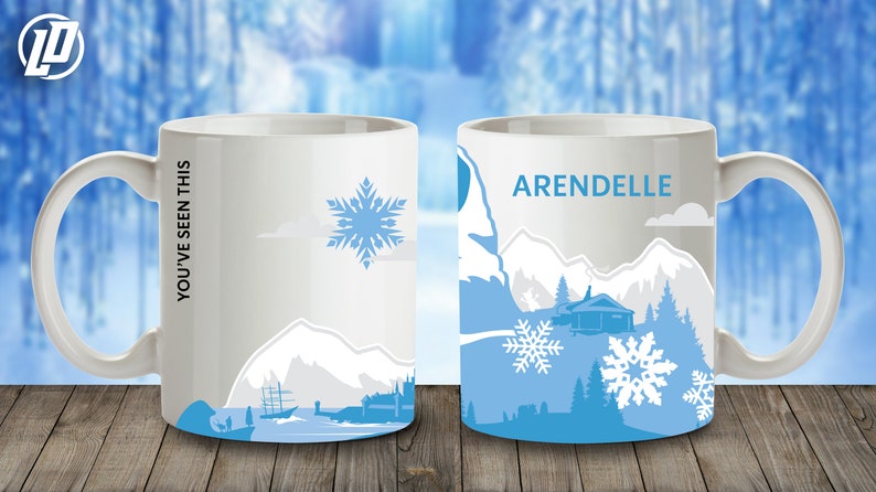 May include: White ceramic mug with a blue and gray design featuring a mountain scene and snowflakes. The text "YOU'VE SEEN THIS" is printed on the left side of the mug. The text "ARENDELLE" is printed on the right side of the mug.