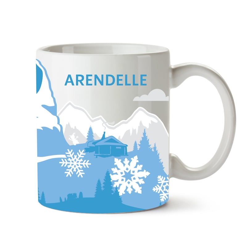 May include: White ceramic mug with a blue and white design featuring a snowy mountain scene, a small cabin, and snowflakes. The text "ARENDELLE" is printed on the mug.