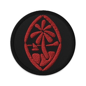 May include: Red embroidered patch with a stylized palm tree design on a black background. The design is a traditional symbol of the island nation of Samoa.