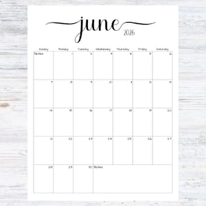 May include: A white calendar page for June 2026. The word "June" is written in cursive script above the calendar grid. The days of the week are listed across the top, with dates filling the grid.