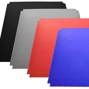 May include: Four large fabric backdrop panels in black, gray, red, and blue. The panels are made of a smooth, wrinkle-resistant material and are perfect for photography or video backdrops.