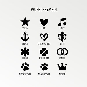 May include: A chart of 12 black and white symbols with German names below each symbol. The symbols include a star, heart, musical note, anchor, open heart, fleur-de-lis, four-leaf clover, flower, ring, paw print, paw print, and crown.