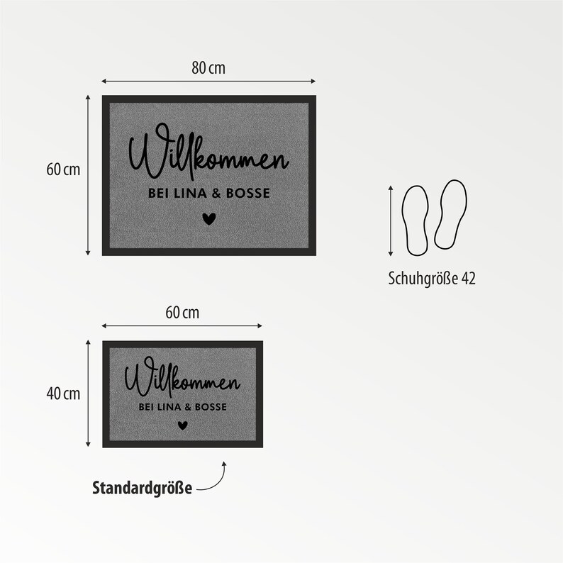 May include: Two doormats with the text "Willkommen bei Lina & Bosse" in black lettering on a grey background. The larger doormat measures 80 cm by 60 cm and the smaller doormat measures 60 cm by 40 cm.
