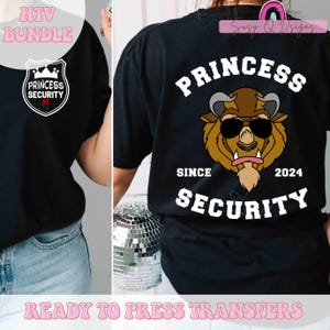 May include: Two black t-shirts with iron-on transfers. One shirt features a cartoon image of a beast with sunglasses and the text "Princess Security Since 2024". The other shirt features a shield with a crown and the text "Princess Security".