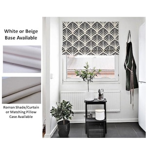 May include: Black and white geometric patterned roman shade with a white or beige base. Roman shade/curtain or matching pillow case available.