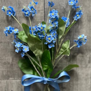 Realistic faux blue forget-me-not bouquet of flowers