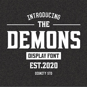 May include: A black background with white text that reads "INTRODUCING THE DEMONS DISPLAY FONT EST.2020 DIGNITY STD". The font is bold and has a vintage style.