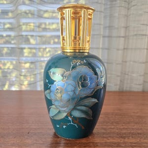 May include: A set of three ceramic mugs with a speckled, matte finish. The mugs are in shades of cream, light gray, and dark gray. Each mug has a simple, minimalist design, perfect for coffee or tea.