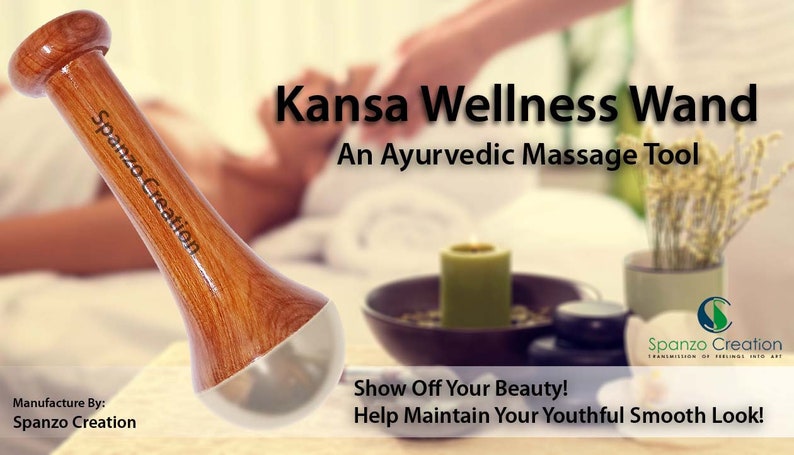 May include: A wooden Kansa Wellness Wand with a rounded top and a silver-colored base. The wand is labeled "Spanzo Creation" and is designed as an Ayurvedic massage tool. The image also includes a lit candle and a bowl.