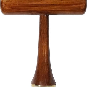 May include: A wooden mallet with a T-shaped design. The handle is a rich brown color, and the striking head is a lighter shade of brown. The bottom of the mallet has a gold-colored, rounded end.