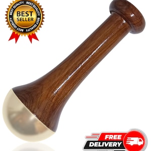 May include: A wooden mortar and pestle with a polished finish. The pestle has a rounded handle and a gold-colored base. The mortar and pestle are designed for grinding herbs and spices. The image also includes a "Best Seller" badge.