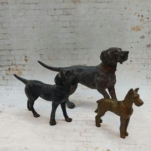 May include: A set of three ceramic mugs with a speckled, matte finish. The mugs are in shades of cream, light gray, and dark gray. Each mug has a simple, modern design and a rounded handle. Perfect for coffee or tea.