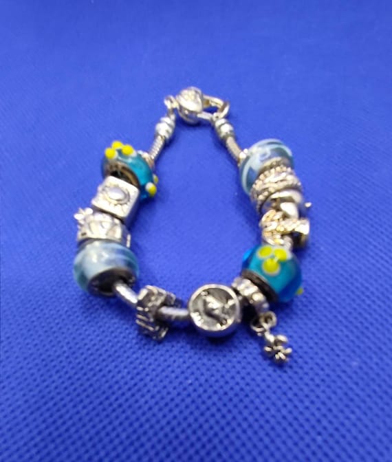 PANDORA BRACELET with 13 charms/clasps OVER $1000 worth