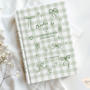 May include: A hardcover book with a light green and white gingham pattern. The cover features the text "Chapter 30, A Chapter Worth Remembering" with decorative bows, hearts, and flowers. The author's name, "Samantha," is also included.